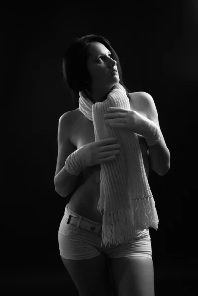 stock image Nude woman in warm scarf on the neck.