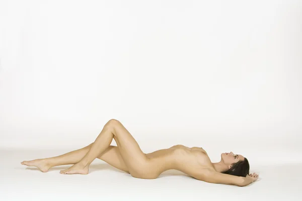 stock image Very sexy and beautiful Caucasian woman posing for a nude figure study isolated on a white background