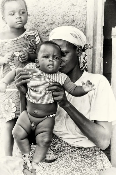 stock image A Ghanaian woman holds her little baby